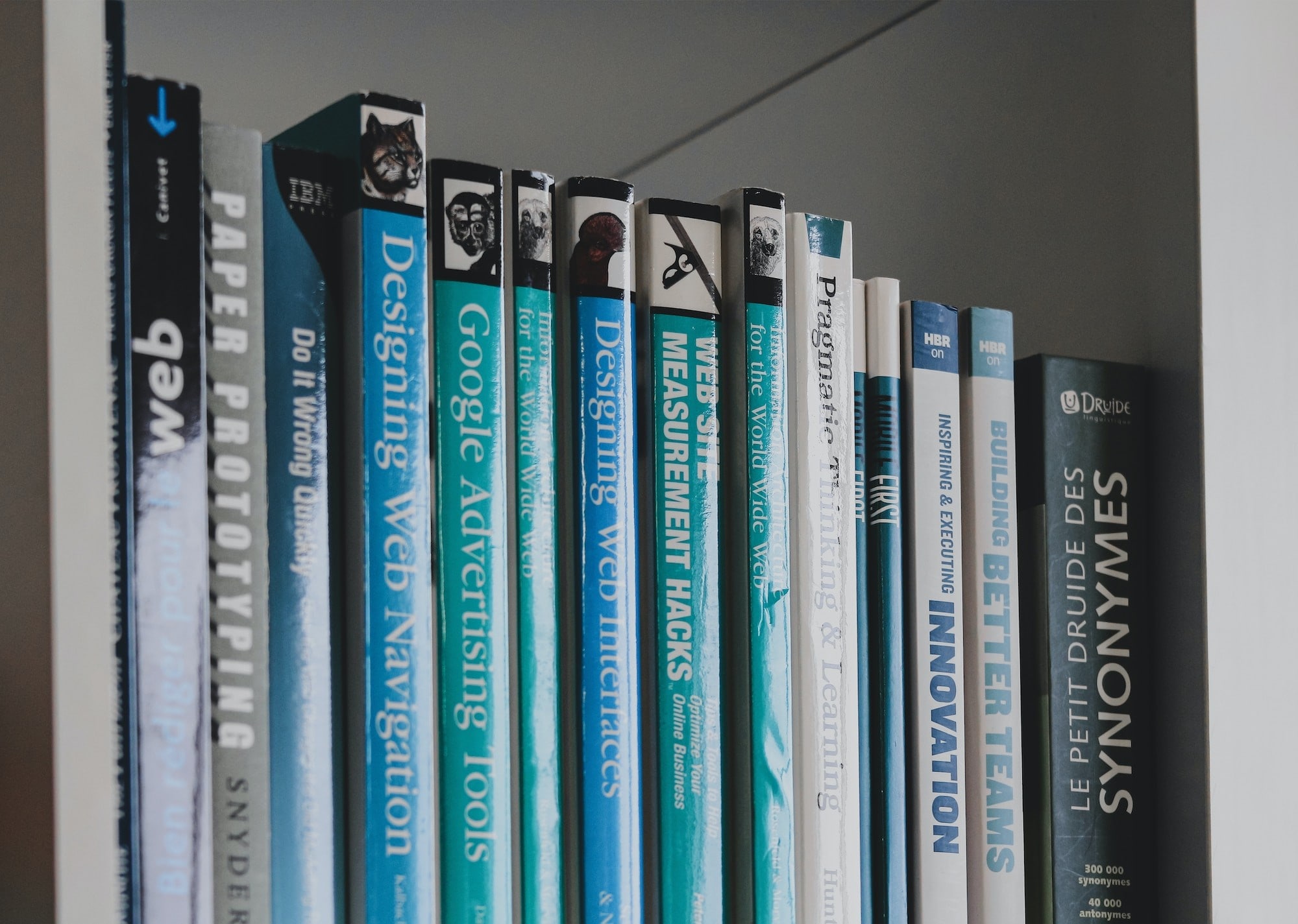A stack of journals is shown on a bookshelf